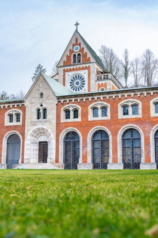 Historic church with Gothic style and brick facade under a cloudy sky, Bad Reichenhall, Alte saltworks, Bavaria, Germany, Europe