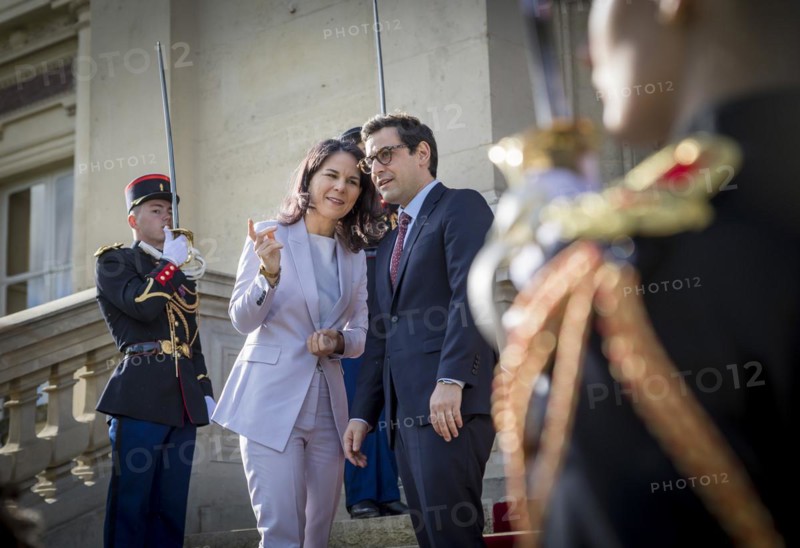 Annalena Baerbock (Alliance 90/The Greens), Federal Foreign Minister, takes a photo as part of her participation in the international humanitarian conference on Sudan and its neighbouring countries. Here she is greeted by Stephane Sejourne, Foreign Minister of France, at the Quai d'Orsay Foreign Ministry. 'Photographed on behalf of the Federal Foreign Office'