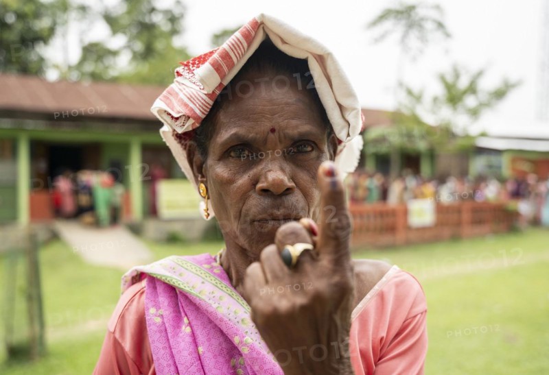 BOKAKHAT, INDIA, APRIL 19: A women show her marked finger after casting vote during the first phase of the India's general elections on April 19, 2024 in Bokakhat, Assam, India. Nearly a billion Indians vote to elect a new government in six-week-long parliamentary polls starting today