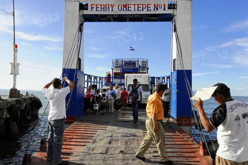 Lake Nicaragua, people boarding a ferry via a jetty, on the shore with clear sky, Nicaragua, Central America, Central America