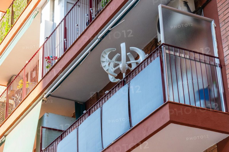 Balcony power plant and mini wind turbine on a balcony of a high-rise building in Barcelona, Spain, Europe