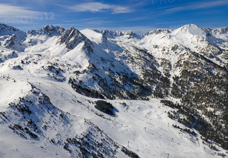 View of several mountain peaks and snowy landscapes with some trees visible, Grau Roig, Encamp, Andorra, Pyrenees, Europe