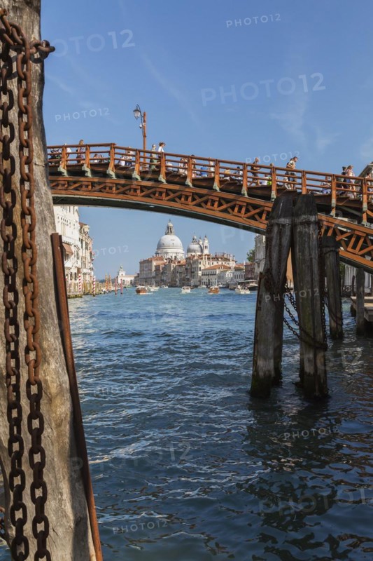 Accademia footbridge over Grand Canal with water taxis, Renaissance architectural residential style residential palace buildings and Santa Maria della Salute basilica, Dorsoduro district, Venice, Veneto, Italy, Europe