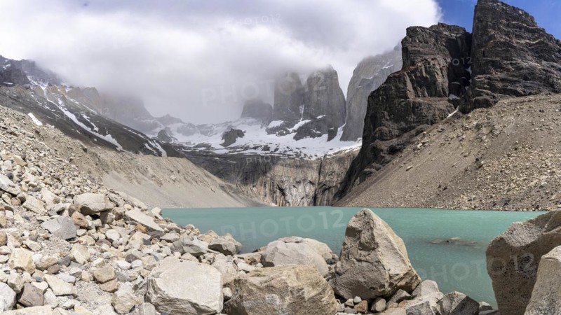 Meltwater lake in front of the Paine Horns, Base of Torres del Paine Hike, Torres de Paine, Magallanes and Chilean Antarctica, Chile, South America
