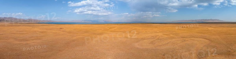 Aerial view, Vast empty landscape at the mountain lake Song Kul in autumn, Moldo Too Mountains, Naryn region, Kyrgyzstan, Asia