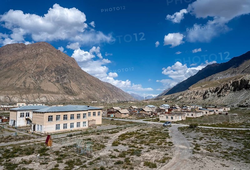 View of houses still inhabited in the ghost town of Engilchek, mountain landscape, Tian Shan, Kyrgyzstan, Asia