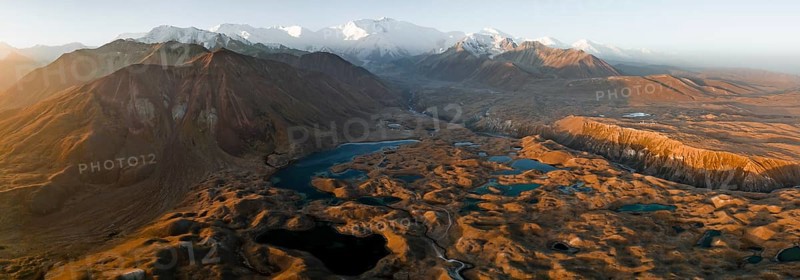 Aerial view, high mountain landscape with glacial moraines and mountain lakes, behind Pik Lenin, Trans Alay Mountains, Pamir Mountains, Osher Province, Kyrgyzstan, Asia