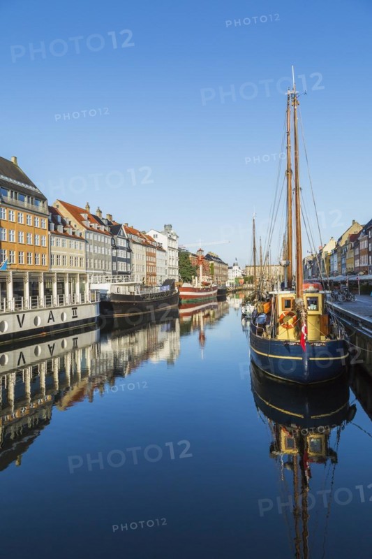 Moored Liva II restaurant boat, ships and colourful 17th century apartment buildings and houses along the Nyhavn canal, Copenhagen, Denmark, Europe