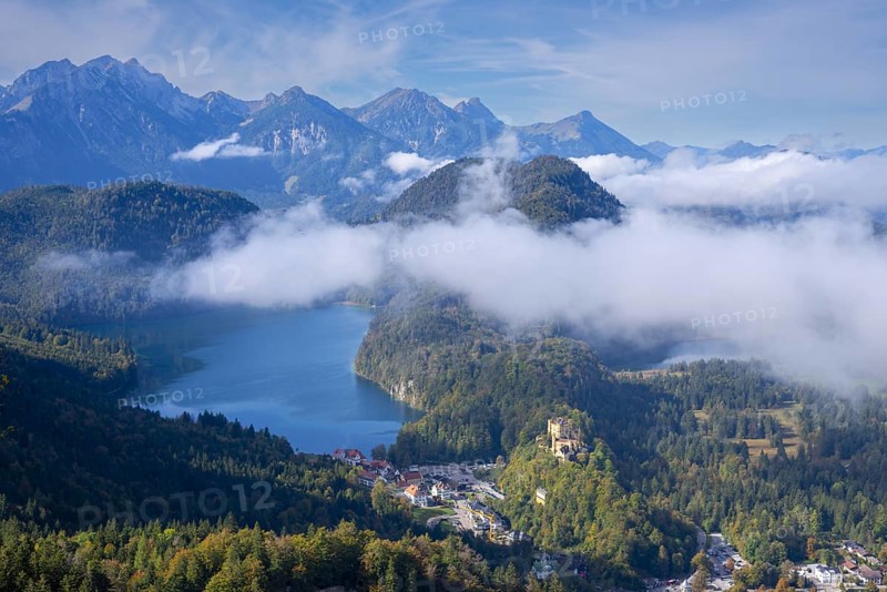 Hohenschwangau Castle, behind it Alpsee and Schwansee in autumn, Romantic Road, Ostallgaeu, Allgaeu, Bavaria, Germany, Europe