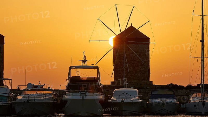 Windmill and boats silhouetted against a sunrise backdrop, twilight, Mandraki Oat, Rhodes, Dodecanese, Greek Islands, Greece, Europe