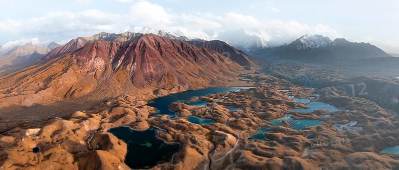 Atmospheric aerial view, high mountain landscape with glacier moraines and mountain lakes, behind Pik Lenin, Trans Alay Mountains, Pamir Mountains, Osher Province, Kyrgyzstan, Asia
