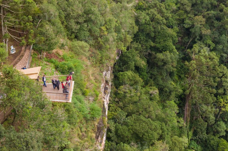 CANELA, BRAZIL, May 12, 2019. Tourists observing a snail cascade (Cascade of Caracol) in park lookout