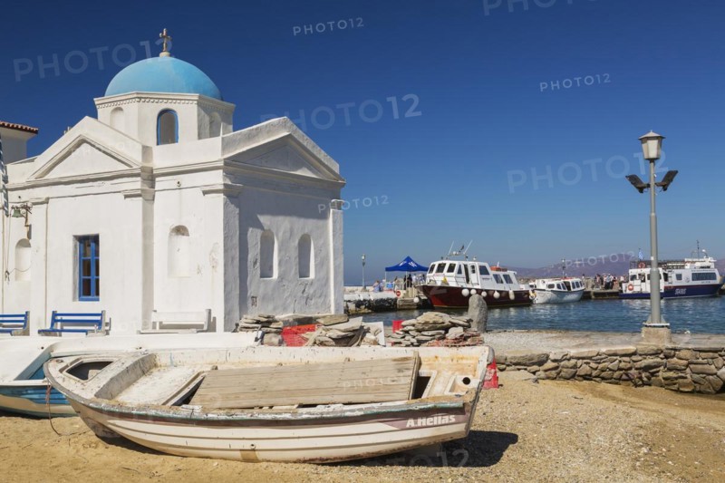 Beached fishing boats and traditional Greek Orthodox church, Old harbour, Mykonos Town, Mykonos Island, Greece, Europe