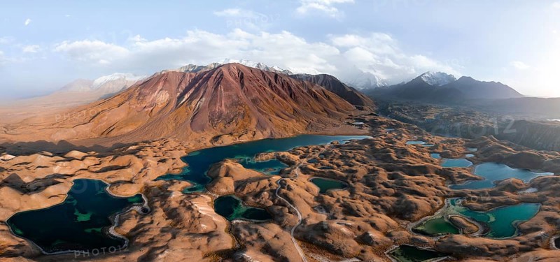 Atmospheric aerial view, high mountain landscape with glacier moraines and mountain lakes, behind Pik Lenin, Trans Alay Mountains, Pamir Mountains, Osher Province, Kyrgyzstan, Asia