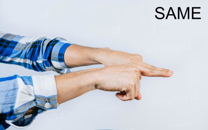 Hand showing word SAME gesture in sign language isolated. Man hand gesturing the word SAME in ASL sign language