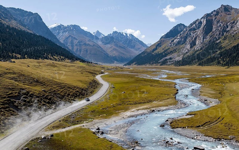 Car on road, mountain river in green mountain valley in the Tien Shan Mountains, Jety Oguz, Kyrgyzstan, Asia