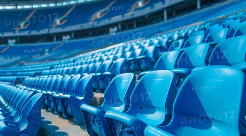 Big empty stadium full of blue seats, AI generated