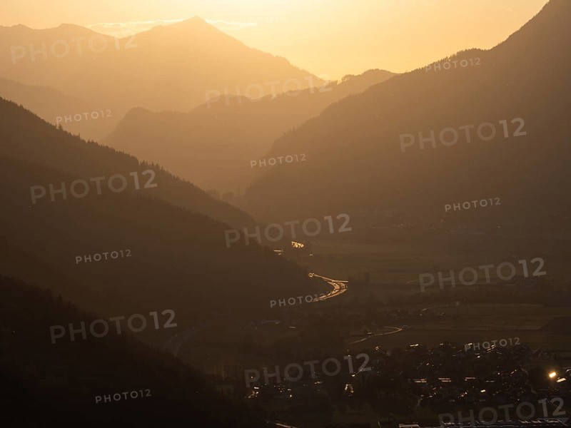 Evening light at sunset over the Liesingtal, in the evening light the village of Traboch, Schoberpass federal road, view from the lowlands, Leoben, Styria, Austria, Europe