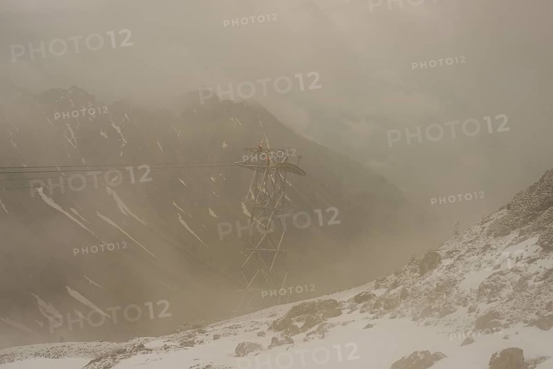 Cable car technicians working in bad weather conditions, Nebelhorn cable car near Oberstdorf, Allgaeu Alps, Allgaeu, Bavaria, Germany, Europe