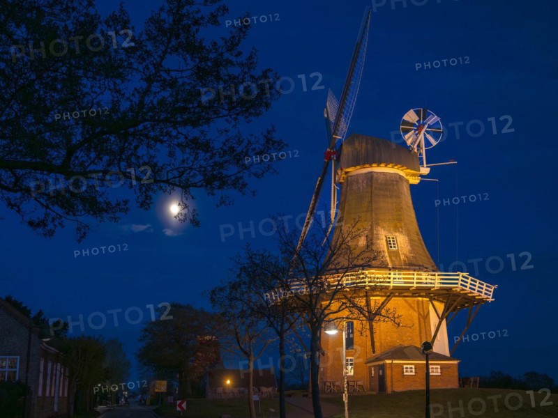 The Green Mill, one of Greetsiel's twin mills, at full moon, Greetsiel, Krummhoern, East Frisia, Lower Saxony, Germany, Europe