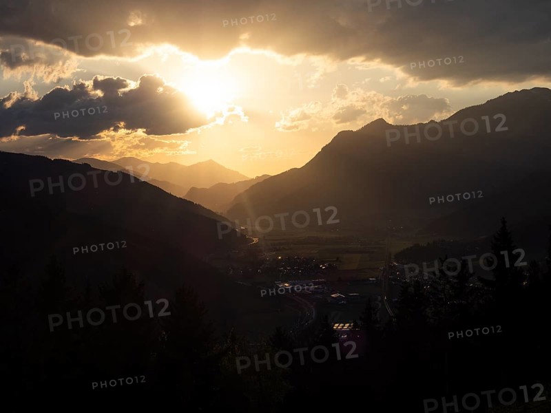 Evening light at sunset over the Liesingtal, in the evening light the village of Traboch, Schoberpass federal road, view from the lowlands, Leoben, Styria, Austria, Europe