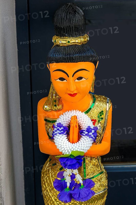 Figure with wreath of flowers at the entrance to the Thai massage parlour, Kaufbeuern, Allgaeu, Swabia, Bavaria, Germany, Europe