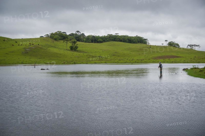 Black bass fisherman fishing with flyfishing, Cambara do sul, Rio Grande do sul, Brazil, South America