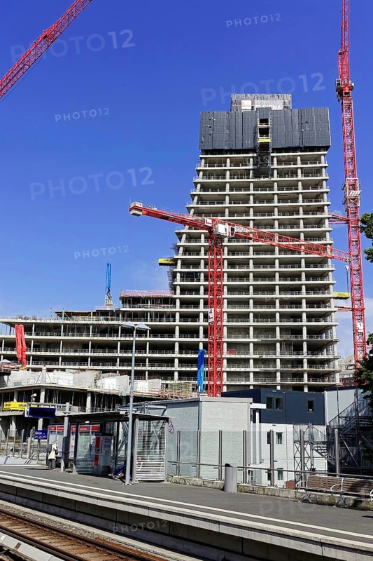 Elbtower, unfinished skyscraper in the east of Hamburg's Hafencity, designed by David Chipperfield, SIGNA HOLDING, A skyscraper under construction behind a train station with some tracks in the foreground, Hamburg-Hafencity, Hamburg, Hanseatic City of Hamburg, Germany, Europe