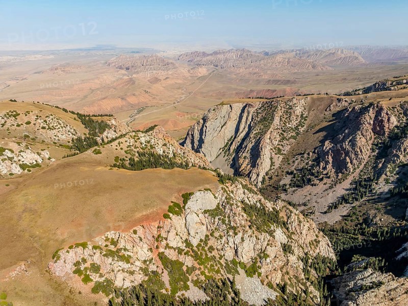 Moldo-Ashuu Pass, mountain landscape with steep rocks between yellow hills, near Baetov, Naryn region, Kyrgyzstan, Asia