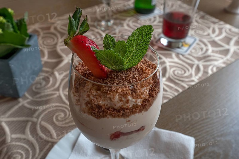Vanilla ice cream with chocolate sprinkles in a glass, Bavaria, Germany, Europe