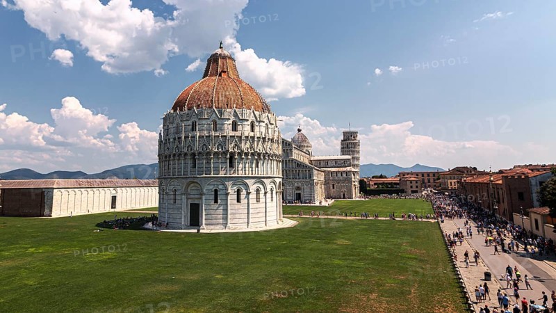 A sunny view of Piazza dei Miracoli in Pisa with the Battistero and the Cathedral of Santa Maria Assunta and the Leaning Tower of Pisa, Pisa Italy Europe