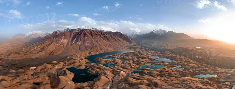 Atmospheric aerial view, high mountain landscape with glacier moraines and mountain lakes, behind Pik Lenin, Trans Alay Mountains, Pamir Mountains, Osher Province, Kyrgyzstan, Asia