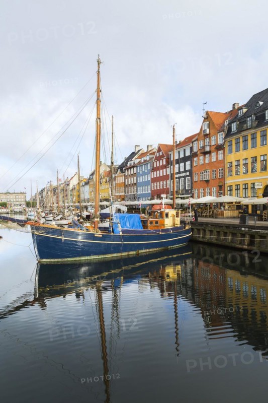 Moored sailboats and colourful 17th century apartment buildings and houses along the Nyhavn canal, Copenhagen, Denmark, Europe