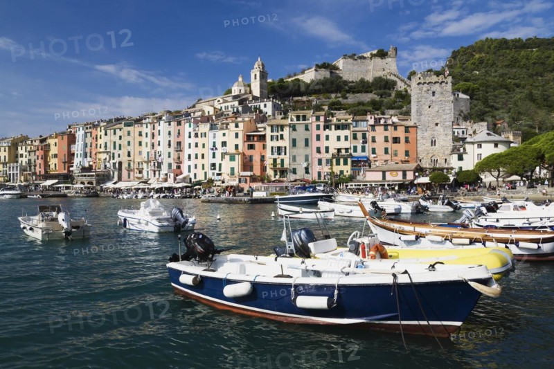 Harbour with fishing boats and colourful apartment building facades at Portovenere, La Spezia province, Italy, Europe