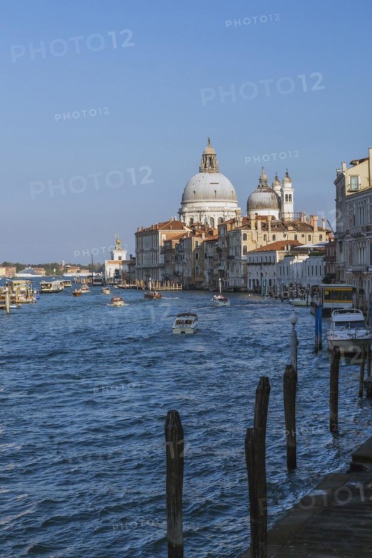 Grand Canal with water taxis, vaporettos and Santa Maria della Salute basilica in Dorsoduro district, Venice, Veneto, Italy, Europe