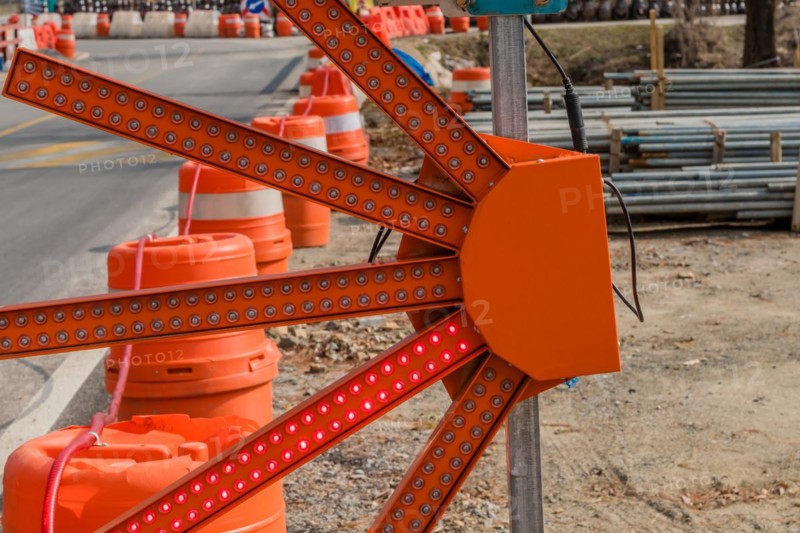 Fan shaped LED construction warning light on rural roadside next to construction site in South Korea