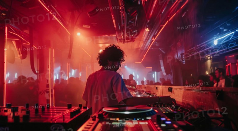DJ is playing modern electronic music at a popular nightclub, AI generated