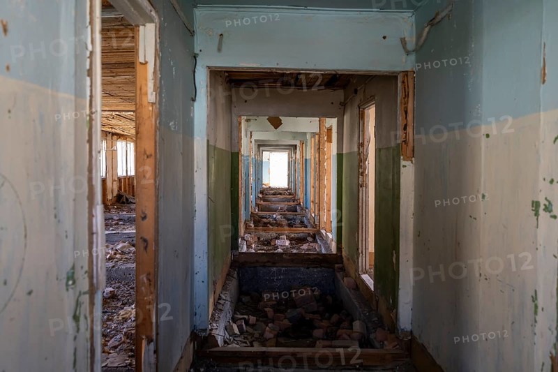 Destroyed abandoned corridor of the old Soviet school, ghost town, Engilchek, Tian Shan, Kyrgyzstan, Asia
