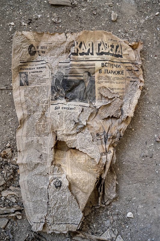 Remains of an old Kyrgyz newspaper from 1924 with Cyrillic writing in an abandoned building, ghost town, Engilchek, Tian Shan, Kyrgyzstan, Asia