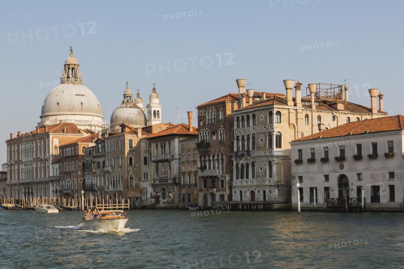 Water taxi on Grand Canal with Renaissance architectural style palace buildings and Santa Maria della Salute basilica, Dorsoduro, Venice, Veneto, Italy, Europe