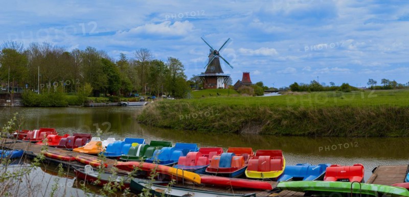 The Greetsiel twin mills, in front boats in the new Greetsieler Sieltief, panoramic photo, Greetsiel, Krummhoern, East Frisia, Lower Saxony, Germany, Europe