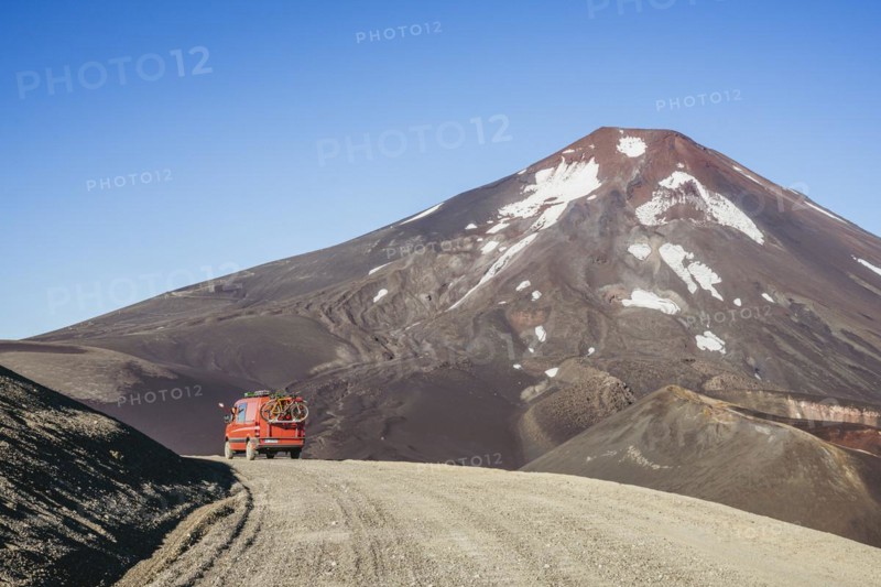 Campervan in front of the Lonquimay volcano, Lonquimay volcano, Malalcahuello National Reserve, Curacautin, Araucania, Chile, South America