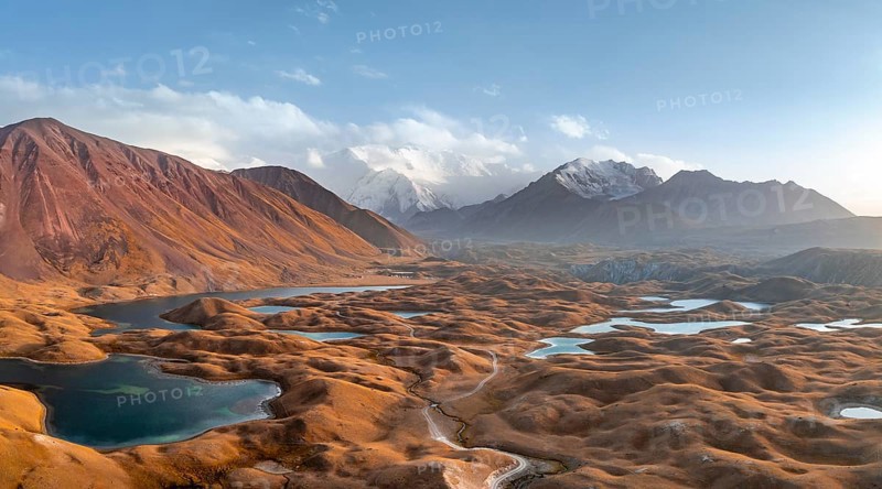 Atmospheric aerial view, high mountain landscape with glacier moraines and mountain lakes, behind Pik Lenin, Trans Alay Mountains, Pamir Mountains, Osher Province, Kyrgyzstan, Asia