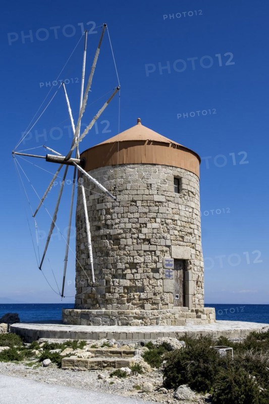 Windmill on the pier at Mandraki Oat, Rhodes Town, Rhodes, Dodecanese, Greece, Europe