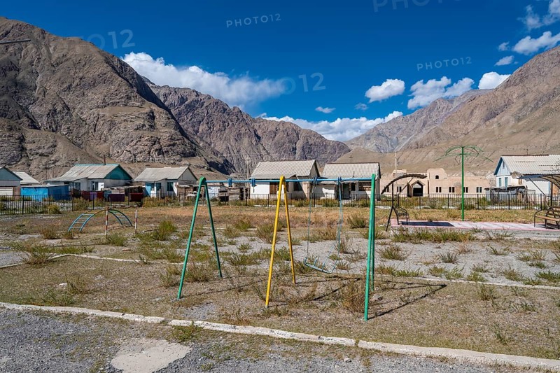 Swings on a playground, ghost town, Engilchek, Tian Shan, Kyrgyzstan, Asia
