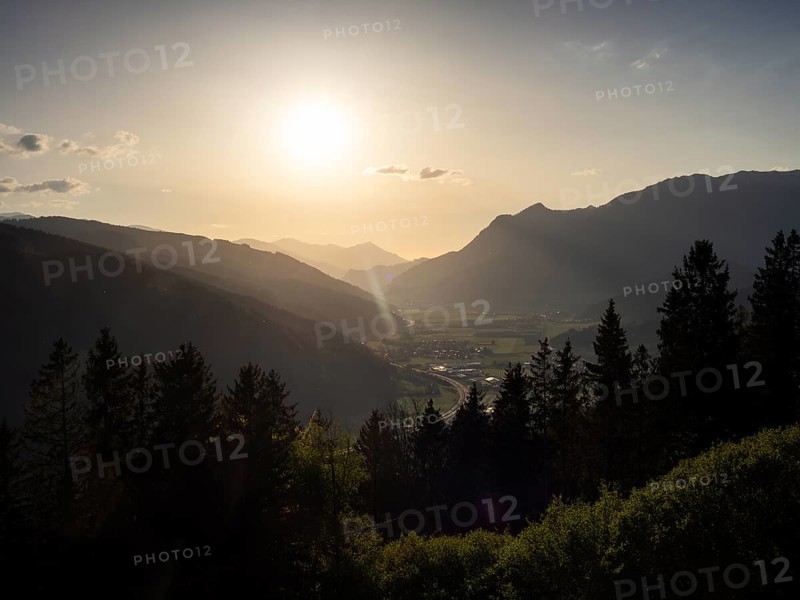 Evening light at sunset over the Liesingtal, in the evening light the village of Traboch, Schoberpass federal road, view from the lowlands, Leoben, Styria, Austria, Europe