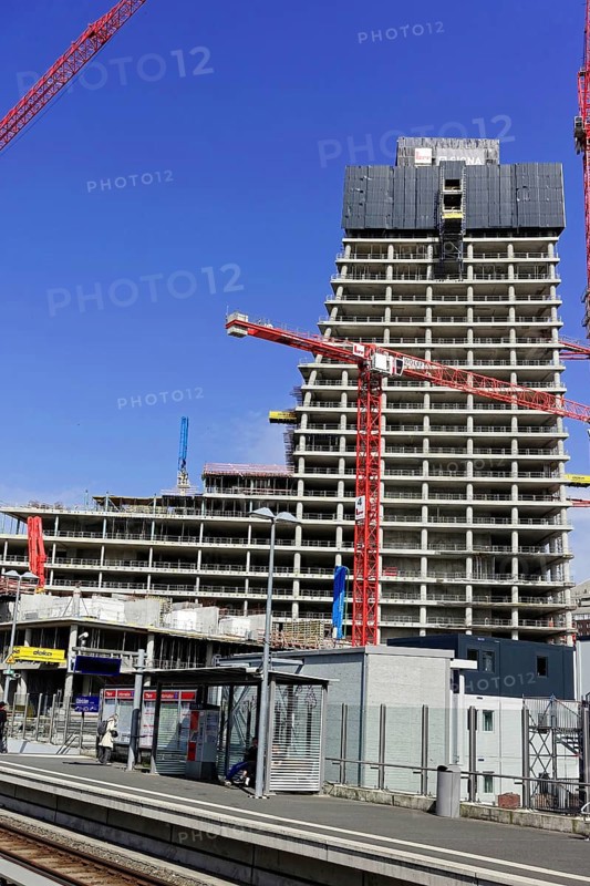Elbtower, unfinished skyscraper in the east of Hamburg's Hafencity, planned by David Chipperfield, SIGNA HOLDING, large construction site with skyscraper and cranes next to a train station on a sunny day, Hamburg-Hafencity, Hamburg, Hanseatic City of Hamburg, Germany, Europe