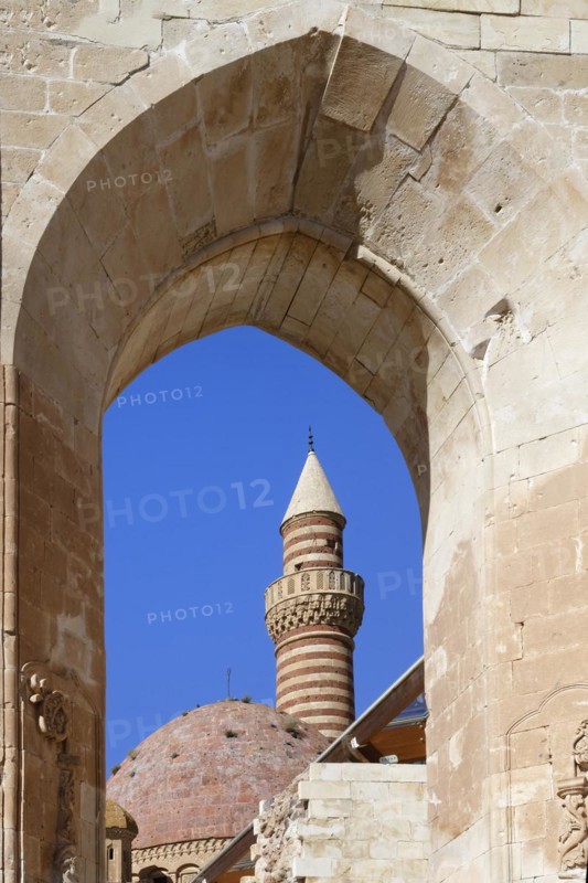 Cupola and minaret of Ishak Pasha palace viewed through an arch, Dogubayazit, Turkey, Asia