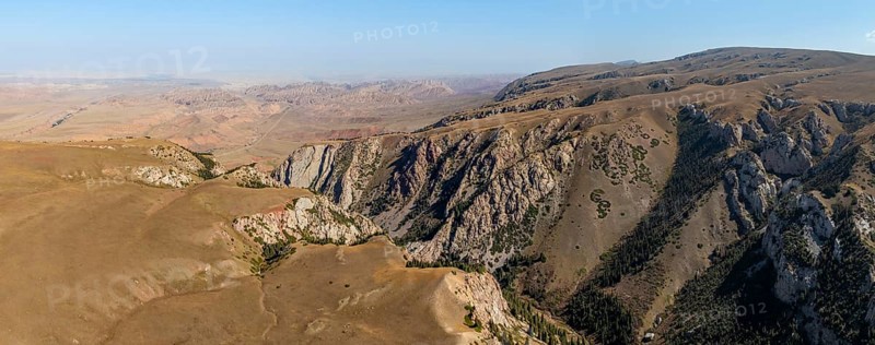 Moldo-Ashuu Pass, mountain landscape with steep rocks between yellow hills, near Baetov, Naryn region, Kyrgyzstan, Asia