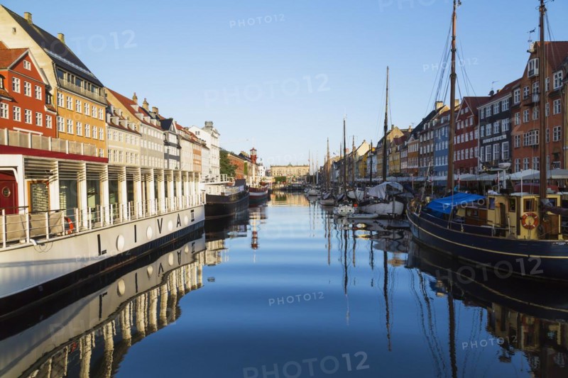 Moored Liva II restaurant boat, ships and colourful 17th century apartment buildings and houses along the Nyhavn canal, Copenhagen, Denmark, Europe